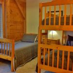 The upper right bedroom has a bunk bed and twin bed and sleeps three. Right Unit: Upper Right Bedroom