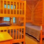 The upper middle bedroom has a bunk bed and twin bed and sleeps three. Right Unit: Upper Middle Bedroom